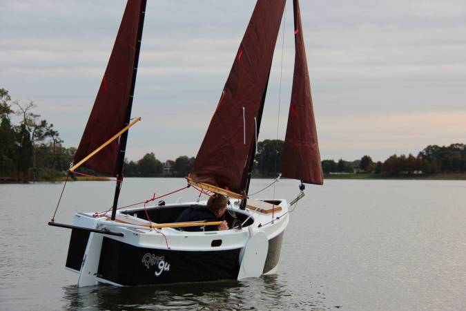 The Nesting Expedition Dinghy is a very compact wooden sailing boat for beach cruising