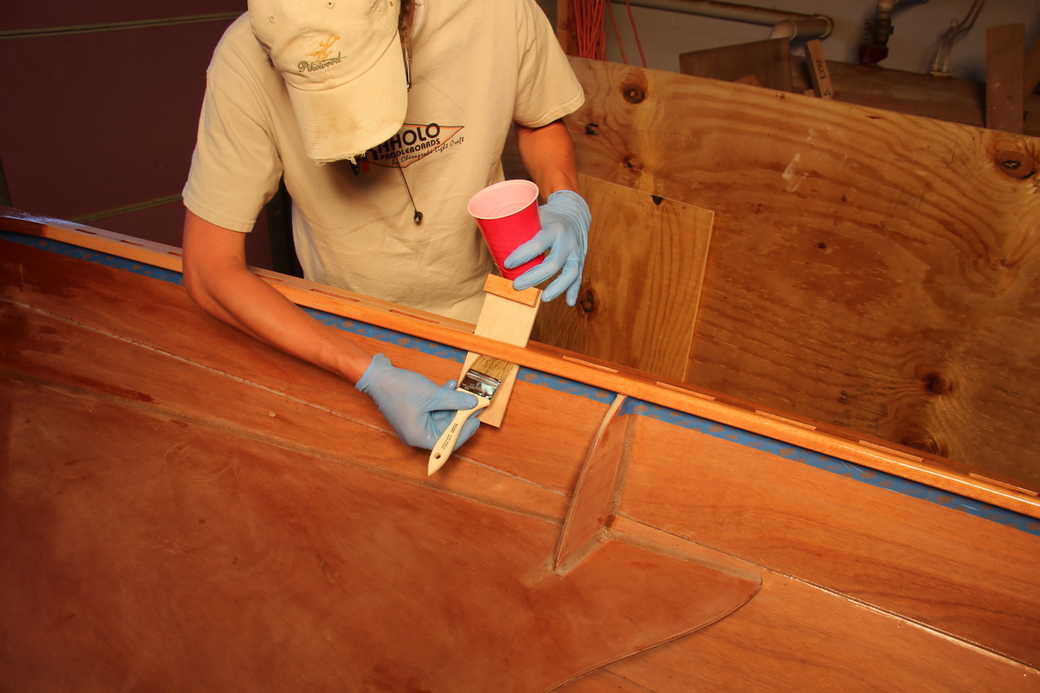 Protect the hull from excess epoxy when coating the rails