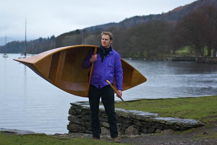 A lightweight wooden Canadian canoe is easily carried