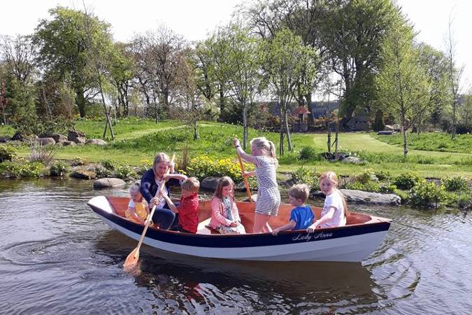 The Dinky Dory is a clinker-style wooden rowing boat