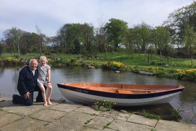 The Dinky Dory is a clinker-style wooden rowing boat