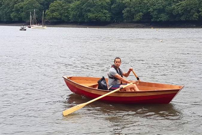 A lightweight wooden rowing boat built on a course at Fyne Boat Kits