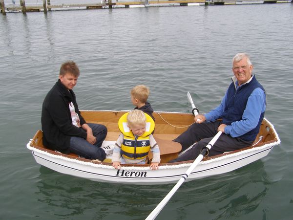 Family in an Eastport Pram that they built