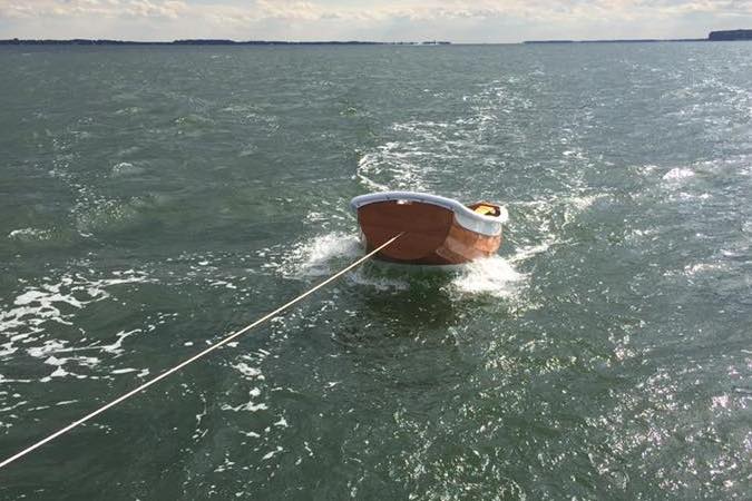 The Eastport Ultralight Dinghy tows light and dry, with the bow well clear of the water
