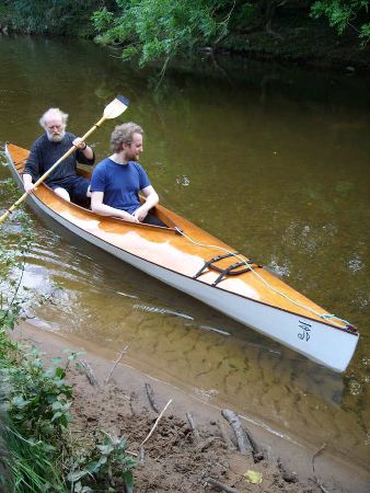 A tandem kayak with a large cockpit that feels like a very buoyant and safe canoe