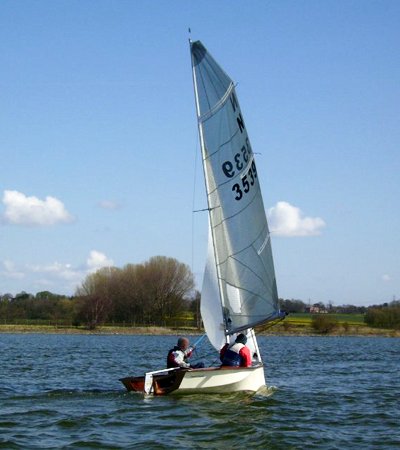 Home made National 12 racing boat under sail