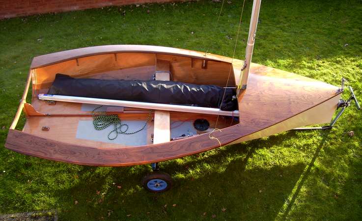 Lightweight wooden National 12 with a varnished deck