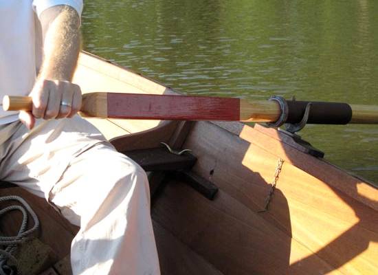 Traditional wooden oars with leather collars