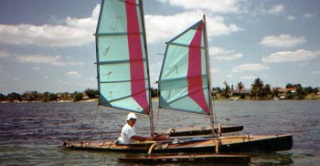 Kayak outrigger on a kayak with two masts