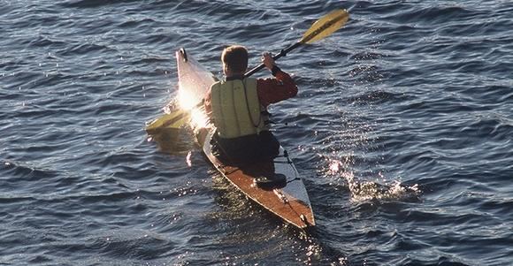 Paddling late into the evening in a home built kayak