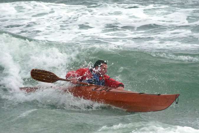 Surfing in the Petrel Play stitch-and-glue sea kayak