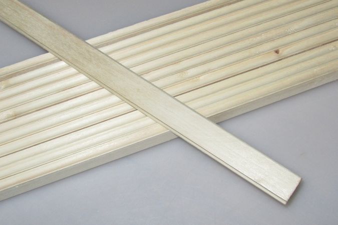 Poplar strips milled with a bead and cove joint for easy strip-planked boat building