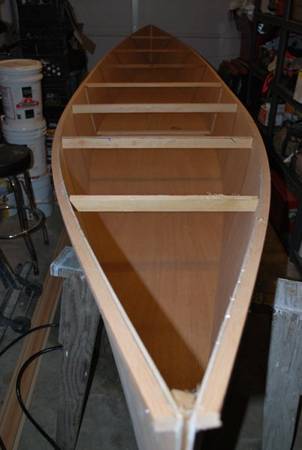 Spacers create the hull shape and are removed when the boat is glued together