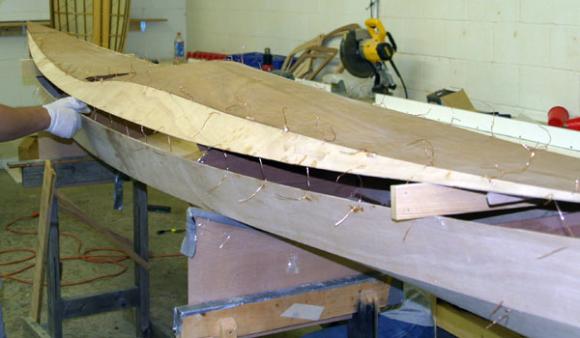 Attaching the wooden deck to a Shearwater sea kayak