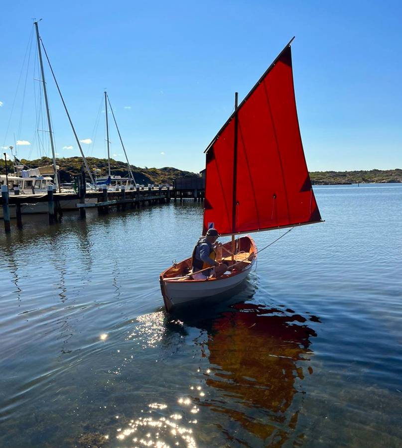 A classic clinker dinghy with a traditional lug sail - Skerry