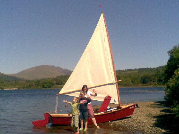 Family fun on a secluded beach in a home made skiff