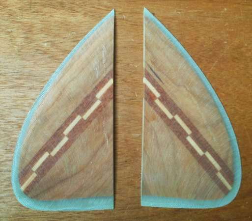 Traditional wooden glass-on keel fins for a surfboard