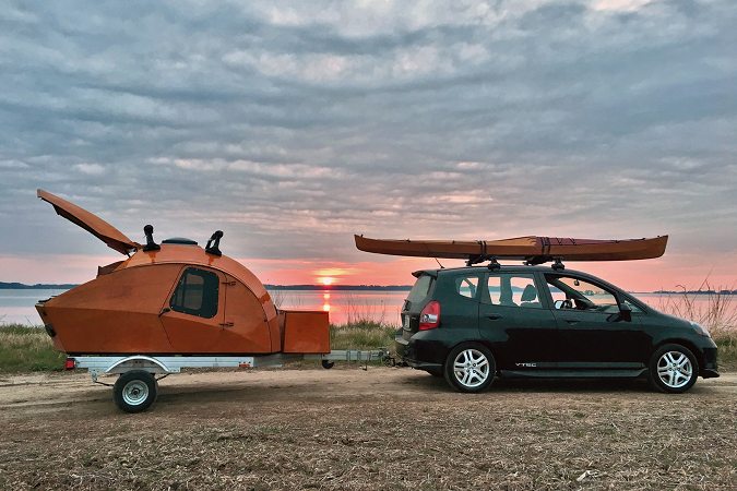 The stitch-and-glue teardrop camper can be towed by a small car