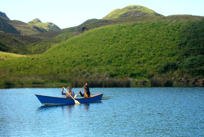 Children exploring a Scottish loch in a canoe from Fyne Boat Kits