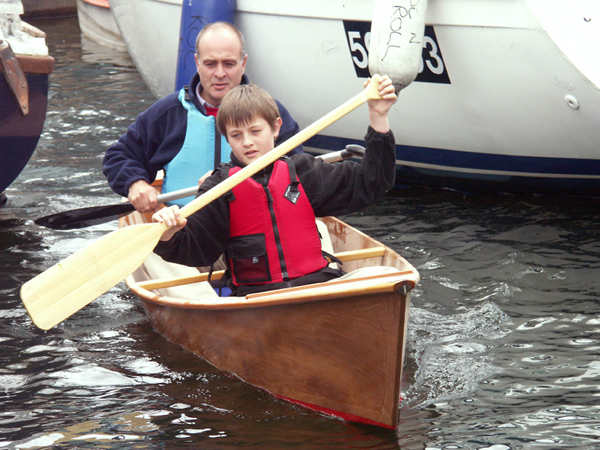 Father and son in home made canoe kit