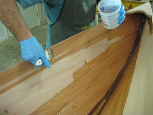 Applying professional epoxy coating to a wooden wherry kit