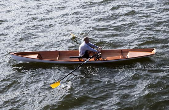 One person rowing a light weight two person rowing wherry from clc