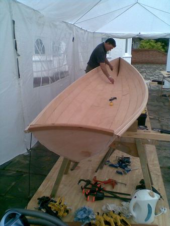 Building a rowing boat in a tent in your garden with the help of fyne boat kits