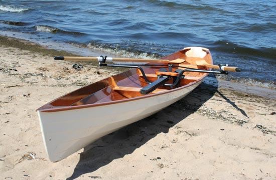A self built rowing wherry on a beach ready for a sea launch