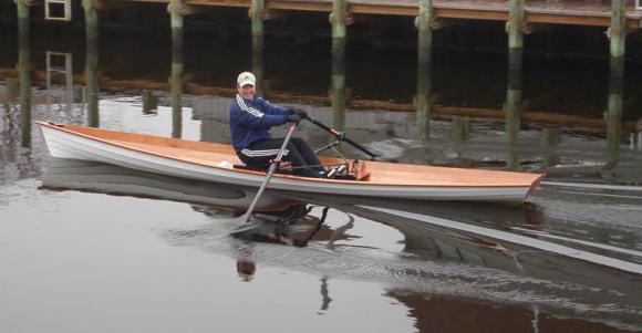 Lightweight wooden wherry rowing boat has a very fast turn of speed