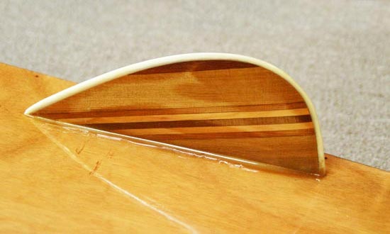 Laminated wooden fins on a Kaholo stand-up paddleboard