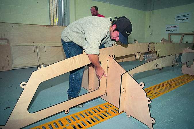 Building the Workstar motorboat uses a slot-together system of tabs, slots and wedges