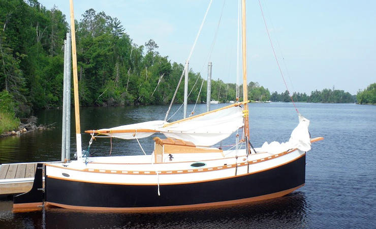 Autumn Leaves wooden canoe yawl designed for engineless coastal cruising by sail and oars