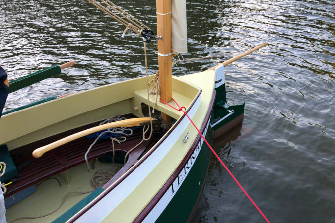 Autumn Leaves wooden canoe yawl designed for engineless coastal cruising by sail and oars