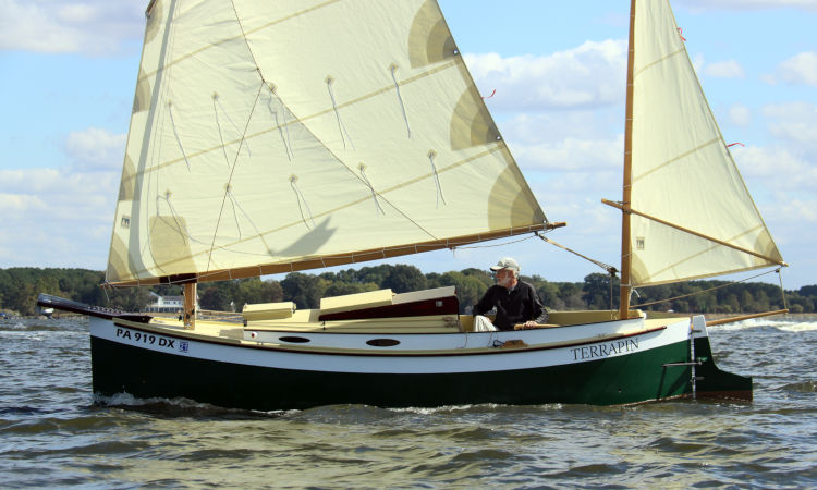 Autumn Leaves wooden canoe yawl designed for engineless coastal cruising by sail and oars