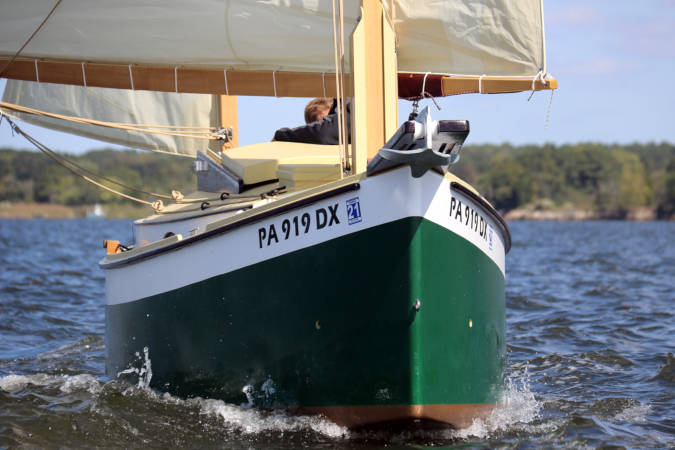 Autumn Leaves wooden canoe yawl designed for engineless coastal cruising by sail and oars