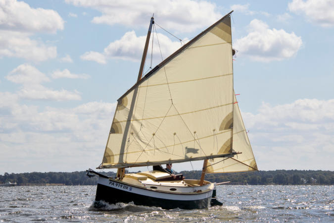 Autumn Leaves wooden canoe yawl designed for engineless coastal cruising by sail and oars