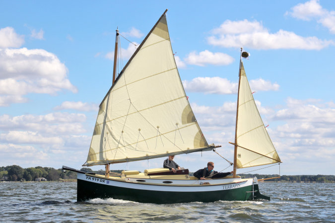 Autumn Leaves wooden canoe yawl designed for engineless coastal cruising by sail and oars