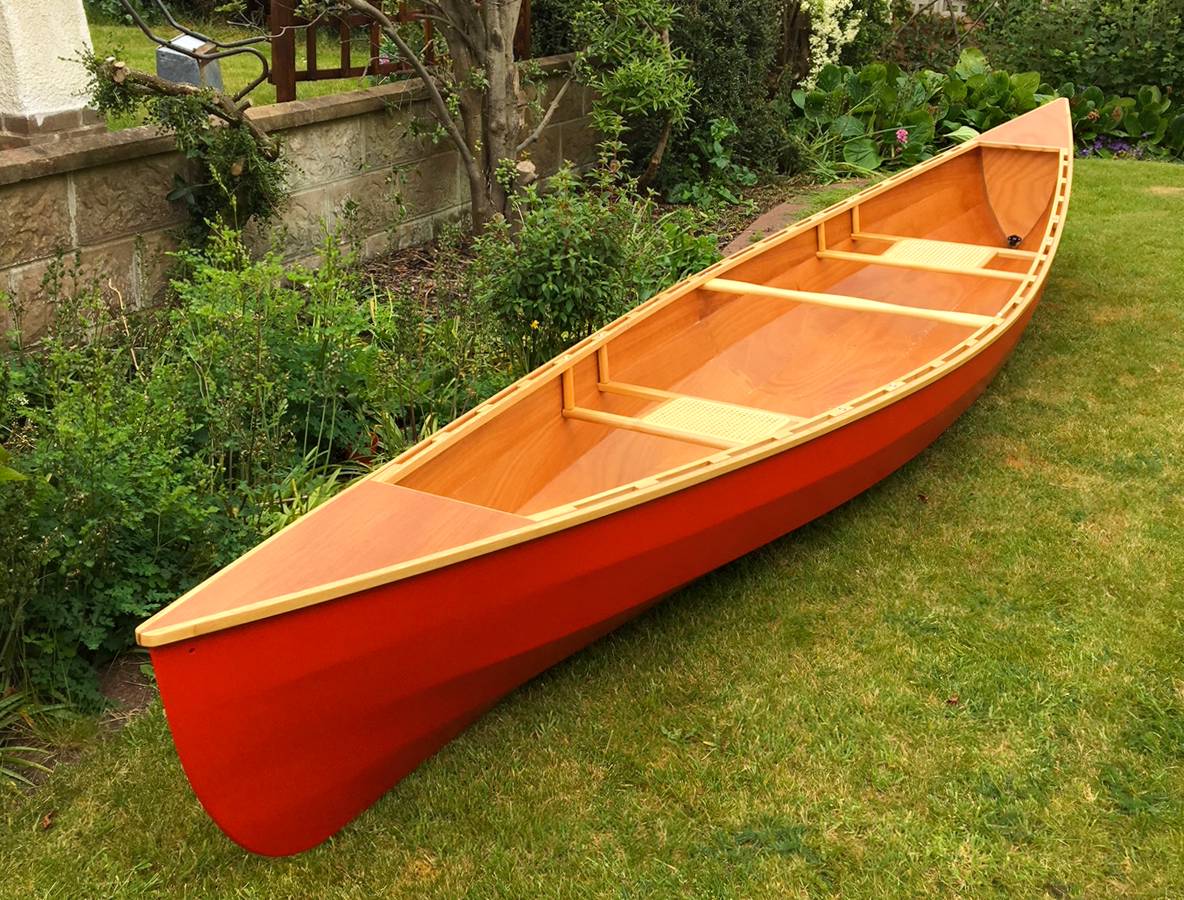 Canadian canoe - a lightweight wooden open boat that is easy to paddle