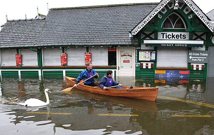 Touring flooded area in a Canadian Canoe