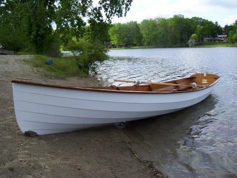 Clinker rowing boat home made on the beach for all to see