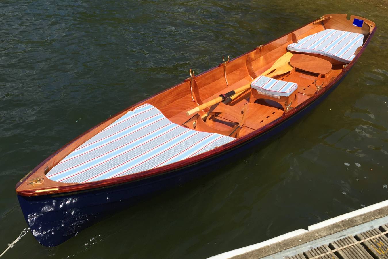 The Chester Yawl is a clinker-style wooden rowing boat with high freeboard