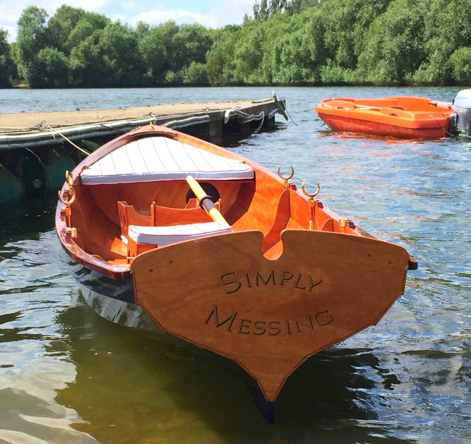 The Chester Yawl is a clinker-style wooden rowing boat with high freeboard