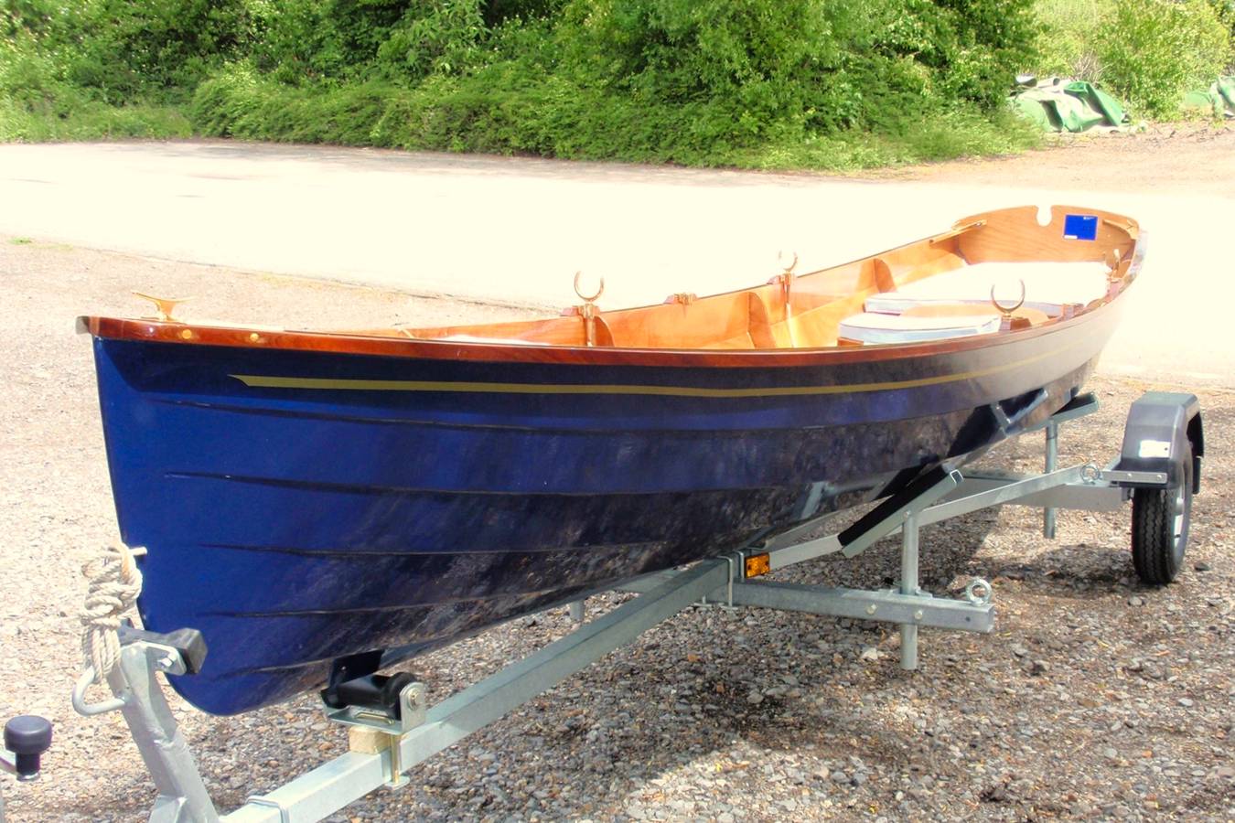 The Chester Yawl is a clinker-style wooden rowing boat with high freeboard