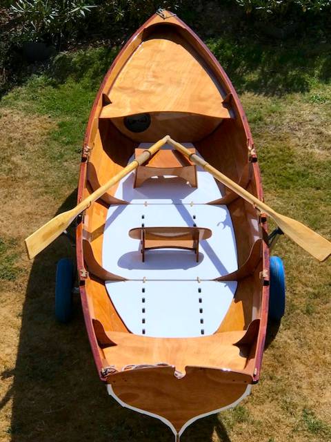 The Chester Yawl is a clinker-style wooden rowing boat with high freeboard