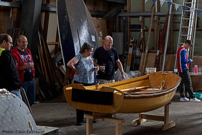 The Coot is a wooden rowing boat built using the cedar-strip method