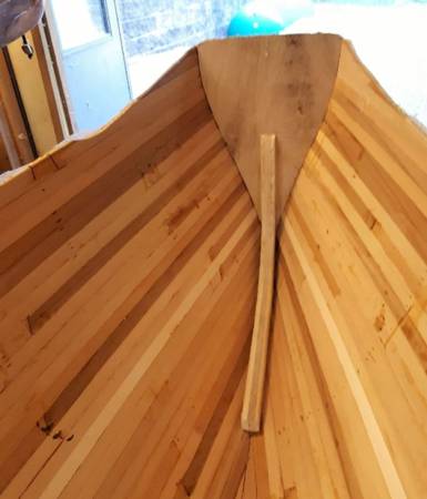 The transom of the Coppermine 17 canoe allows mounting a small outboard motor for auxiliary power