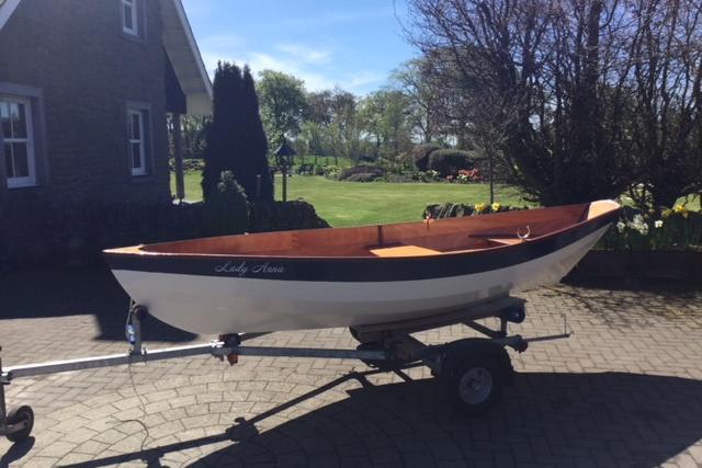 The Dinky Dory is a clinker-style wooden rowing boat
