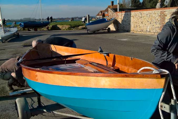 A lightweight wooden rowing boat built on a course at Fyne Boat Kits
