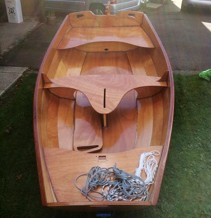 The Eastport Pram is a clinker-style wooden sailing and rowing dinghy