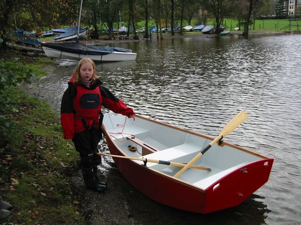 Proud girl owner and builder of a sailing boat